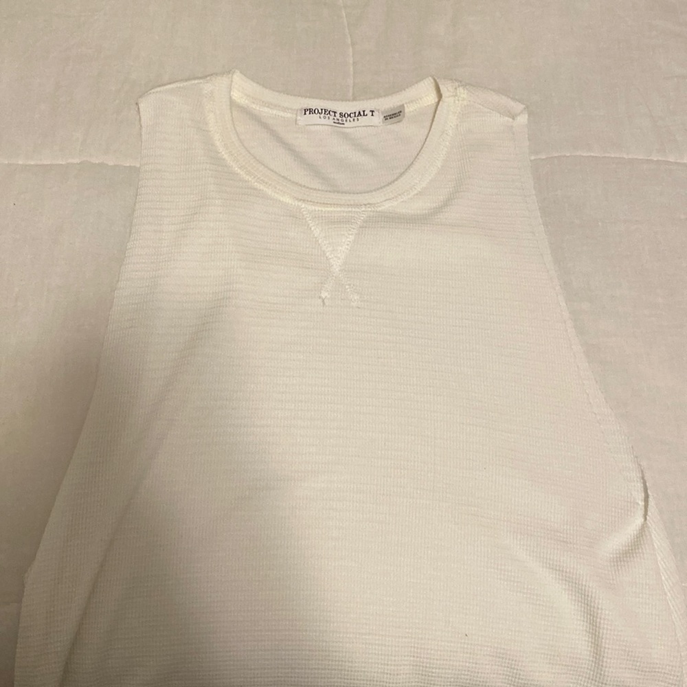 off white colored tank, large arm holes, super cute with a bandeau bra under!